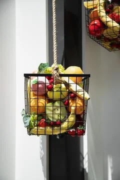 Assorted artificial fruits as decor element . Basket filled with artificial.. Stock Photos