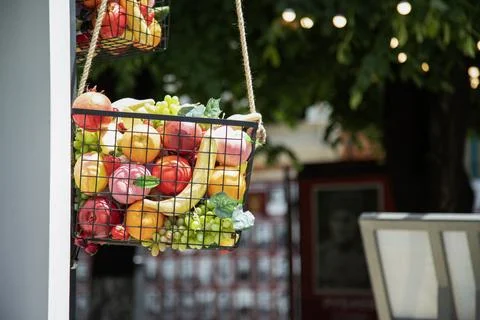 Assorted artificial fruits as decor element . Basket filled with artificial.. Stock Photos