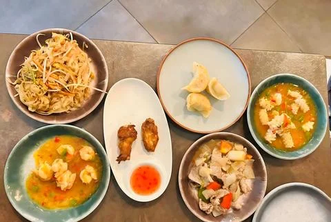 Assorted Asian Appetizers on a Metal Table Stock Photos