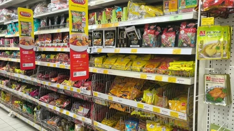 Assorted Asian Spices in Commercial Packaging on Supermarket Shelves Видео 331759984