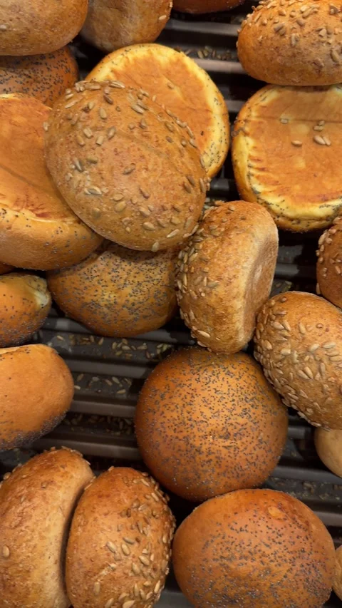 Assorted bakery buns and small bread rolls stacked together Stock Footage 317320978