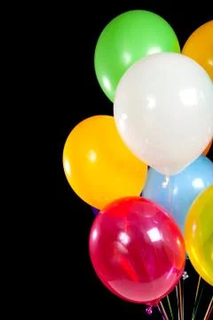 Assorted balloons on a black background Stock Photos
