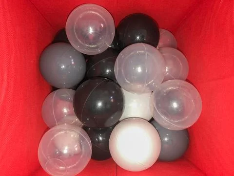 Assorted Balloons in a Red Box Stock Photos