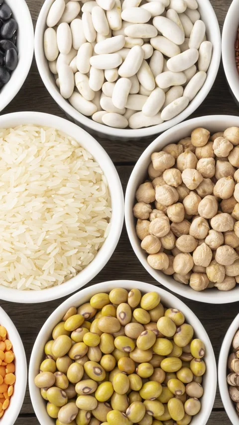 Assorted beans and grains on white bowls Stock Footage 321010203