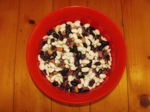 Assorted Beans in a Red Bowl Stock Photos