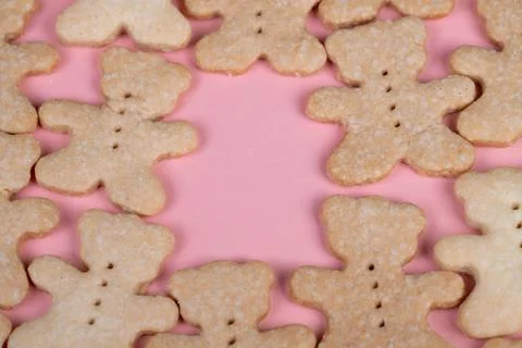 Assorted bear cookies laid over pink surface, close topdown view showcasing u Stock Photos