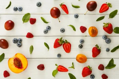 Assorted berries on white wooden table top view Stock Photos