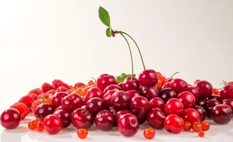 Assorted berry on a white background. Cherries, raspberries, red currants. 스톡 사진