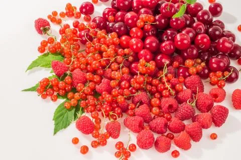 Assorted berry on a white background. Cherries, raspberries, red currants. Foto stock