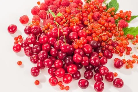 Assorted berry on a white background. Cherries, raspberries, red currants. 写真素材