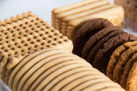 Assorted biscuits in a packaging tray Stock Photos