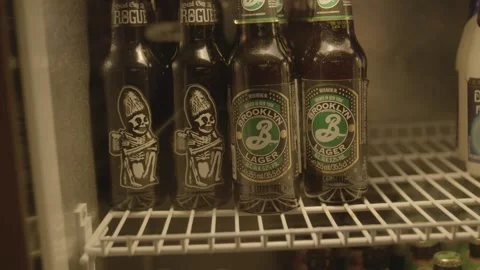 Assorted Bottled Drinks on Refrigerator Shelf in Bar, Beijing, China Stock Footage 345754201