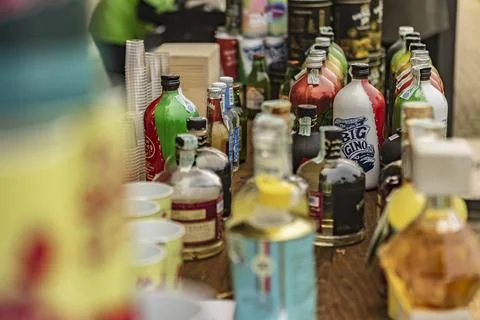 Assorted Bottles of Alcohol on Table Stock Photos