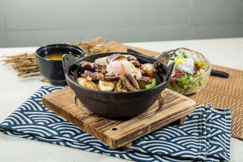 Assorted braised rice bowl with egg garnish Stock Photos