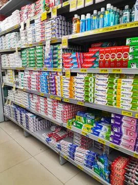 Assorted brand of toothpaste on supermarket shelf. Stock Photos