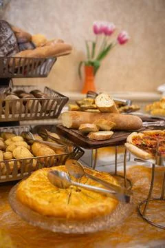 Assorted bread basket on the buffet table Stock Photos