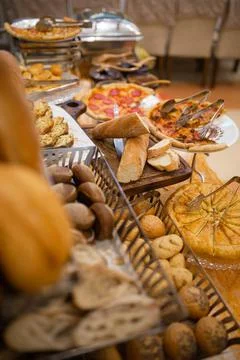 Assorted bread basket on the buffet table Stock Photos