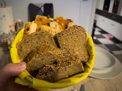 Assorted Bread Selection in a Woven Basket 写真素材