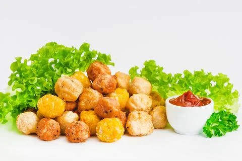 Assorted Breaded Chicken nuggets Fillet with salad on a White Background,food at Stock Photos