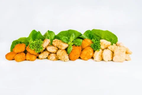 Assorted Breaded Chicken nuggets Fillet with salad on a White Background,food at Stock Photos