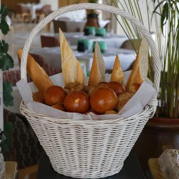 Assorted breads in a basket in afood counter Stock Photos