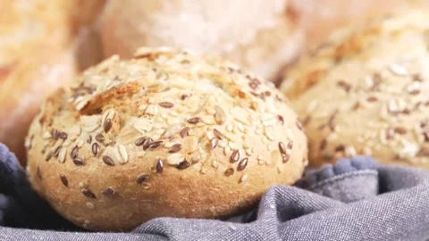 Assorted breads. Buns with seeds, baguettes, brown bread. Stock Footage 303977428