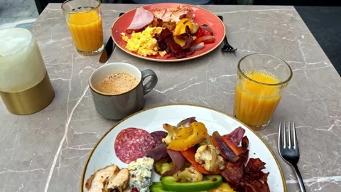 Assorted Breakfast Plates With Juice and Coffee on Marble Table, Norway Cafe Stock Footage 340122117