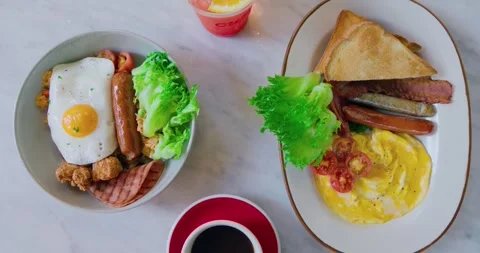 Assorted Breakfast Plates Served on White Marble Table Stock Footage 335069644