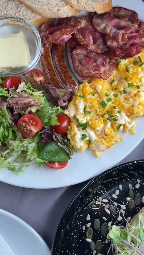 Assorted breakfast spread with omelette scrambled eggs granola and fresh fruit Stock Footage 341626374