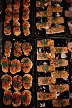 Assorted Bruschetta on Black Trays Stock Photos