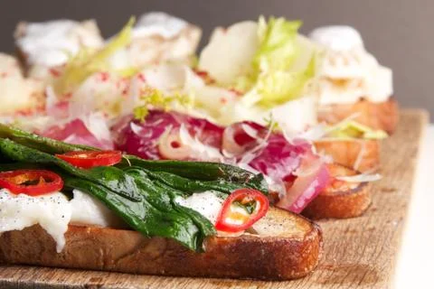 Assorted bruschetta with various toppings. Appetizing bruschetta. Stock Photos