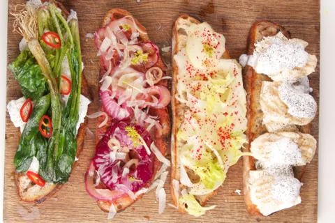 Assorted bruschetta with various toppings. Appetizing bruschetta. Stock Photos