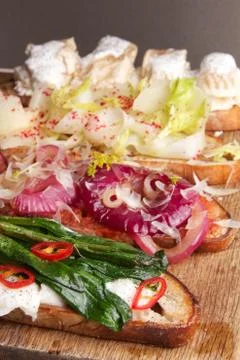 Assorted bruschetta with various toppings. Appetizing bruschetta. Stock Photos