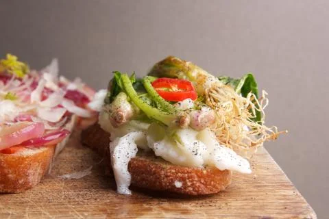 Assorted bruschetta with various toppings. Appetizing bruschetta. Stock Photos