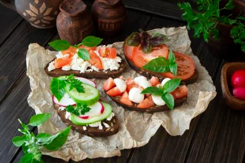Assorted bruschetta with various toppings. Appetizing bruschetta or sandwiches Stock Photos