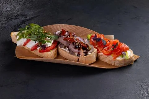 Assorted bruschettas on a plate. Stock Photos