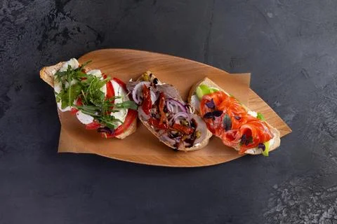 Assorted bruschettas on a plate. Stock Photos
