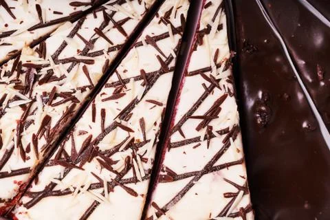 Assorted cake cut into pieces. Selective focus Stock Photos