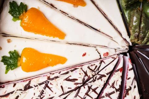 Assorted cake cut into pieces. Selective focus Stock Photos