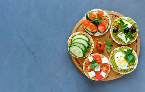 Assorted canapes, appetizers or tapas on a board Stock Photos