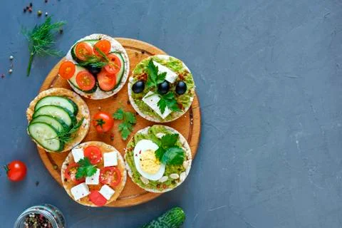 Assorted canapes, appetizers or tapas on a board Stock Photos