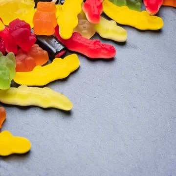 Assorted candies on dark background Stock Photos