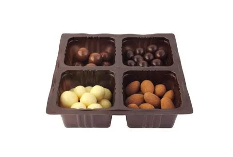 Assorted candies in plastic container Stock Photos