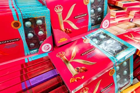 Assorted candy boxes on display in a grocery store aisle during the day Stock Photos
