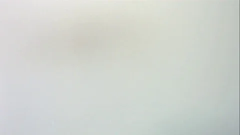 Assorted Candy Spills Onto White Table Stock Footage 70333736