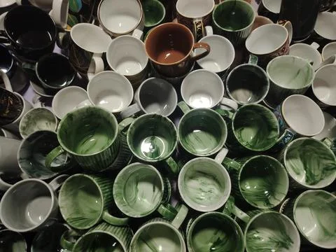 Assorted Ceramic Mugs Displayed Together Showcasing Variety of Colors and D.. Stock Photos
