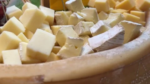 Assorted cheese cubes in closeup view showing texture color and dairy detail. Stock Footage 316812614