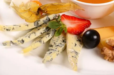 Assorted cheese with honey Stock Photos