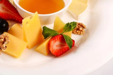 Assorted cheese with honey Stock Photos