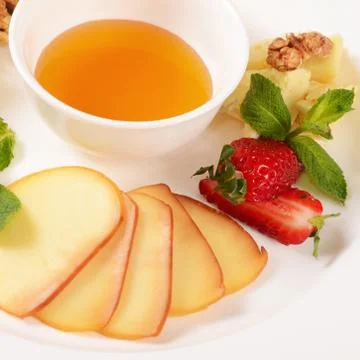 Assorted cheese with honey Stock Photos